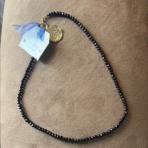 Black Beaded Necklace with Gold Pendant